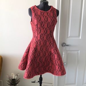 Flared fitted orange lace black dress